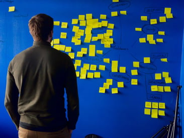 Man standing in front of blue puzzle mat